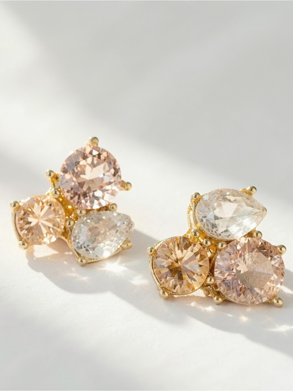 Coach Gold earrings studs with three round pink and clear gemstones